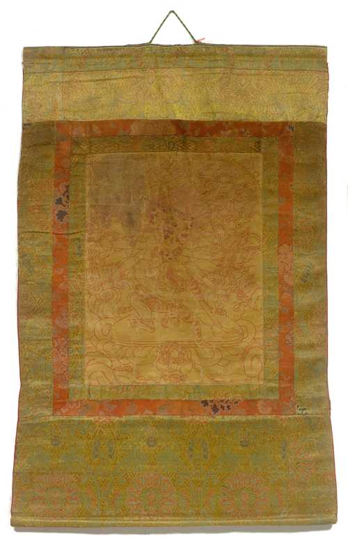 A GOLD-GROUND THANGKA WITH A WRATHFUL DEITY, Tibet, 18th c. 41.5x33 cm. Brocade mounting. Wrinkled.