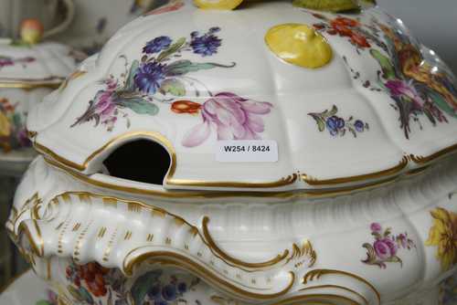 AN EXTENSIVE 'ROCOCO FORM' DINNER SERVICE WITH FLORAL DECORATION AND GOLD BORDERS (90 pieces),