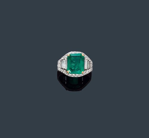 EMERALD AND DIAMOND RING, BULGARI. Platinum 950 and yellow gold 750. Casual-elegant band ring. The top set with 1 step-cut, very fine Columbian emerald weighing ca. 3.80 ct, minimal signs of wear, within a border of 6 baguette-cut diamonds weighing ca. 0.40 ct, set throughout with 50 brilliant-cut diamonds weighing ca. 1.00 ct, 1 is missing. Engraved Bulgari, 4.61. Size ca. 55. With case and GGTL Short Report No. 14-B-2457.