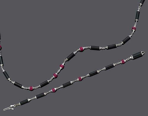 RUBY, ONYX AND GOLD NECKLACE WITH BRACELET, BY CARTIER.