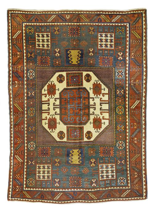 KARATCHOPH antique.Green central field with a white central medallion. Geometrically patterned throughout in attractive colours. Red wine glass border. Signs of wear, 190x240 cm.