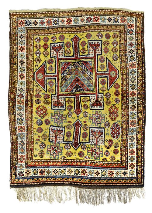 CAUCASIAN antique.Yellow central field with a shield-shaped central medallion, geometrically patterned, white edging, 165x210 cm.