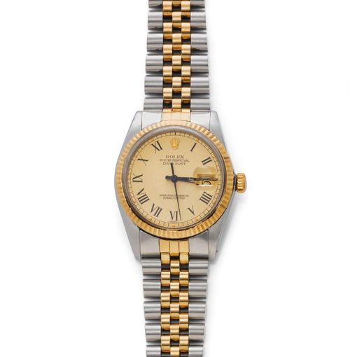 GENTLEMAN'S WRISTWATCH, ROLEX DATEJUST, 1980s. Steel and yellow gold 750. Ref. 16013. Steel case No. 6440377 with fluted gold lunette, screw-down back and gold-coloured crown. Gold-coloured dial with black Roman numerals, luminous hands, central second, date with magnifying glass. Plexiglas, scratched. Automatic, movement No. 0414341, Cal. 3035, Glucydur balance. Bicolour Jubilee band, slightly stretched. D 36 mm.