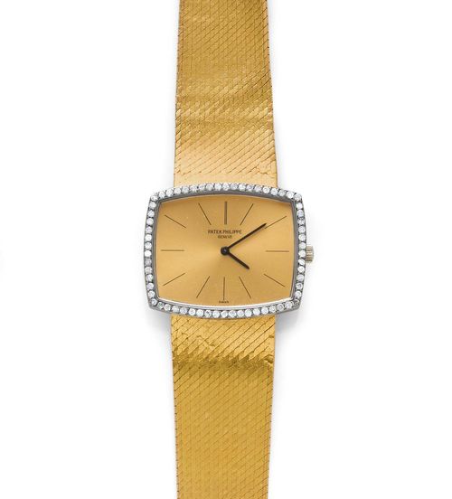 DIAMOND GENTLEMAN'S WRISTWATCH, PATEK PHILIPPE, 1967. Yellow gold 750, 71g. Ref. 3528/2. Rectangular-convex, extra-flat case with white gold lunette set with diamonds weighing 0.79 ct. Gold-coloured dial with black indices and hands, signed. Hand winder, extra-flat movement No. 1137749, Cal. 175, Gyromax balance. Satin-finished, original Milanaise gold band, with signs of wear, L ca. 18.5 cm. With excerpt from the archive, June 2012.