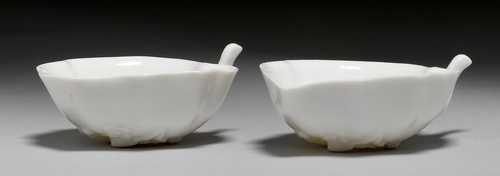 A PAIR OF BLANC DE CHINE BOWLS SHAPED AS LEAVES.