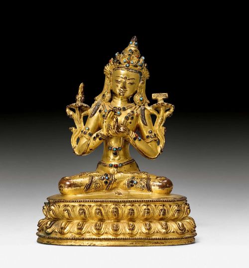 A FINE GILT BRONZE FIGURE OF MANJUSHRI WITH TURQUOISE AND CORAL INLAYS. Tibet, 15th/16th c. Height 18 cm. Sealed.