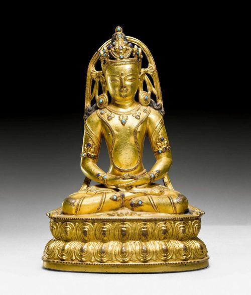 A FINE GILT COPPER FIGURE OF AMITHABA WITH RICH STONE INLAYS. Tibet, 16th c. Height 19.5 cm. Consecration plate lost.