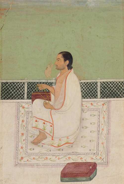 A MINIATURE PAINTING OF A SAGE SEATED ON A TERRACE.