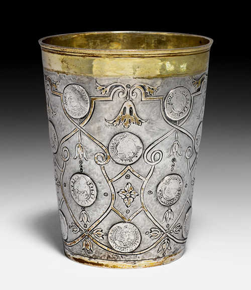 LARGE BEAKER WITH COINS,
