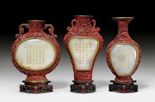 THREE CARVED RED LACQUER WALL VASES WITH INLAID JADE PLAQUES AND IMPERIAL POEMS. China, Qianlong period. Height 17.8 -19 cm. Poems of the Qianlong  Emperor in gilt lishu script. (3)