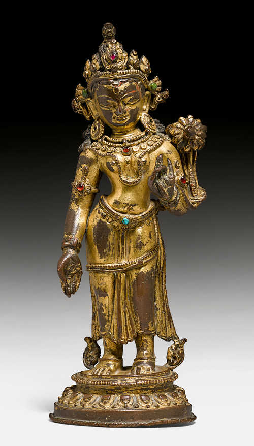A CHARMING GILT COPPER ALLOY FIGURE OF THE STANDING TARA.