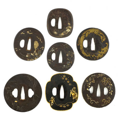 SEVEN TSUBA WITH GOLD DAMASCENED DETAILS.