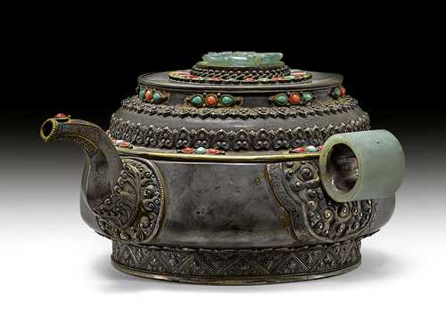A SILVER TEA POT DECORATED WITH JADE CARVINGS.