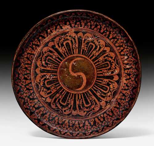 A RARE PAINTED AND OILED LEATHER DISH.