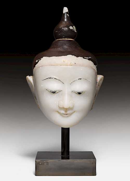 A LARGE ALABASTER HEAD OF BUDDHA.