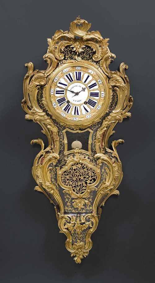 IMPORTANT CARTEL CLOCK,Regence, the bronze by C. CRESSENT (Charles Cressent, maitre 1720), the dial and movement signed ETIENNE LE NOIR A PARIS (Etienne II Lenoir, maitre 1717), Paris um 1720/30. Brown tortoiseshell with exceptionally fine engraved brass inlays and gilt bronze. Gilt dial with raised decoration and 25 enamel cartouches with blue Roman hours and black Arabic minutes. 2 fine blued hands. Fine verge escapement striking the ½ hours on bell. Rich gilt mounts and applications. Enamel cartouches with small restorations and fine hairline cracks. 50x25x110 cm.