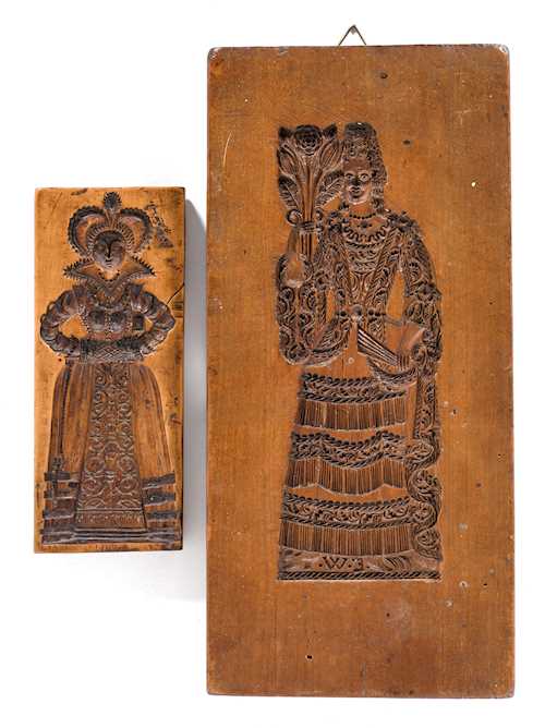 TWO BAKING MOULDS WITH DEPICTIONS OF WOMEN