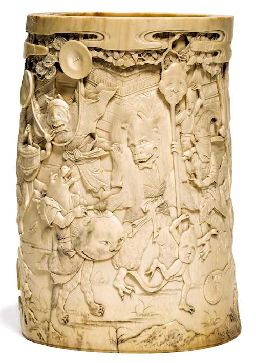 AN IVORY CARVING DEPICTING THE NIGHT PARADE OF THE 100 DEMONS.