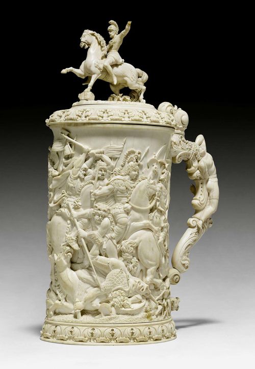 IMPORTANT TANKARD Historicism, German, probably Erbach circa 1880. Ivory carved with battles scene after Renaissance models. Some losses. H 39 cm.