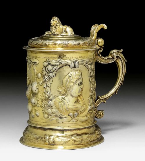 SILVER-GILT TANKARD WITH COVER,marked Danzig, 2nd half of the 17th century. Maker’s mark: PHL. Chased and embossed. With medallion with Emperor between fruit clusters. H 20 cm, 1025 g.