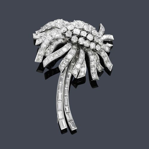 DIAMOND BROOCH, GÜBELIN, ca. 1950. Platinum 950, 29g. Elegant brooch designed as a stylized flower, set throughout with 105 brilliant-cut diamonds weighing ca. 7.00 ct, the stem entirely set with 15 graduated, baguette-cut diamonds, weighing ca. 1.50 ct. Signed, No. 2811-36.