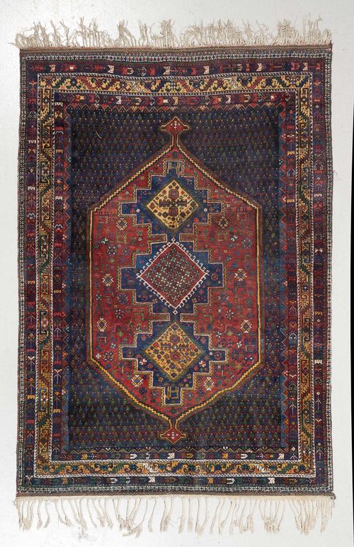 AFSHAR old.Red central medallion on a dark blue ground, geometrically patterned, yellow  edging, 163x217 cm.