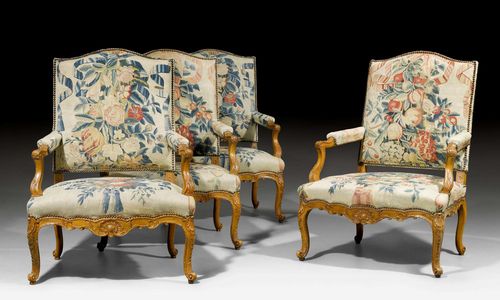 SET OF 4 LARGE TAPESTRY  FAUTEUILS &quot;A LA REINE&quot;,Regency, from a Parisian master workshop, ca. 1725/30. Beech, exquisitely carved with flowers, leaves, cartouches and decorative frieze. Polychrome tapestry cover with flowers, leaves and bows, with decorative bullen nails. Tapestry, in part not original. 70x55x40x106 cm. Provenance: - La Vieille Fontaine, Lausanne. - Private collection, Suisse romande. A pair of very similar fauteuils &quot;&#224; la reine&quot; were sold at the Koller Auction in December 2004 (Lot No. 1113).