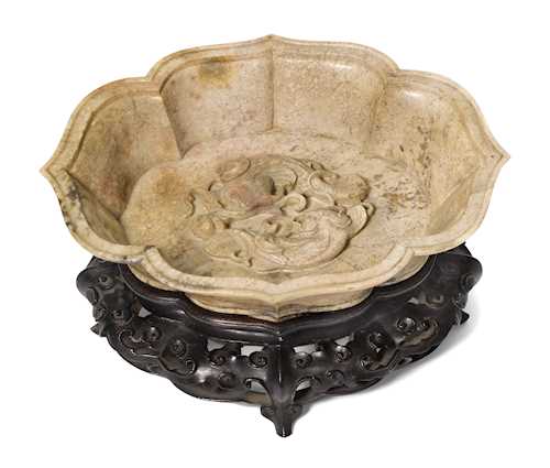 A FINELY CARVED CHICKEN BONE JADE MARRIAGE BOWL.