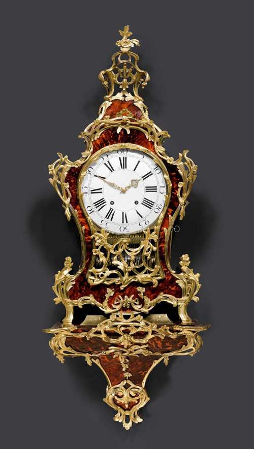 LARGE RED TORTOISESHELL CLOCK WITH CARILLON and plinth,Louis XV, Neuenburg circa 1760. Red tortoiseshell and gilt bronze. Enamel dial. Fine verge escapement with 4/4 striking on 2 bells, carillon with 13 bells and brass cylinder triggered on the hour and on demand. Rich bronze mounts and applications. 52x27x128 cm.