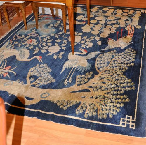 CHINA antique.Blue ground, patterned with trees and birds, 190x270 cm.