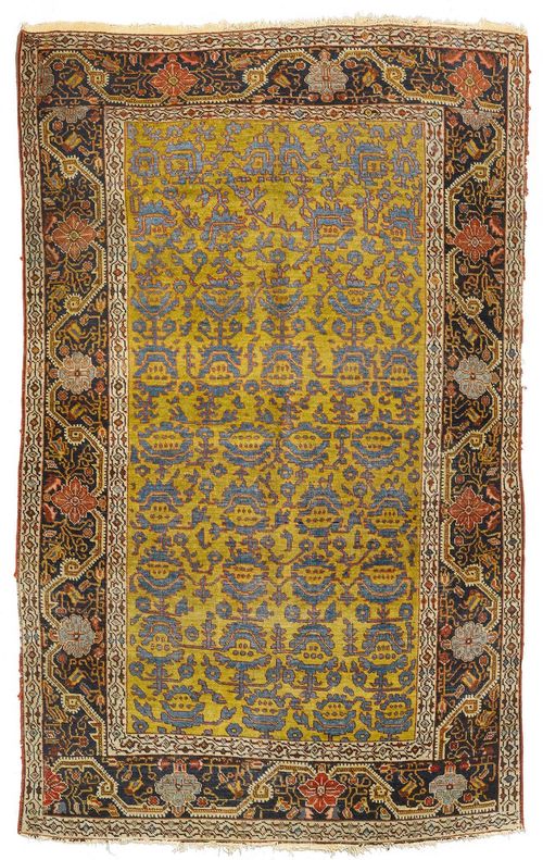 FERAGHAN antique.Yellow ground with stylized flowers in blue, black border with trailing flowers, strong signs of wear, 130x205 cm.