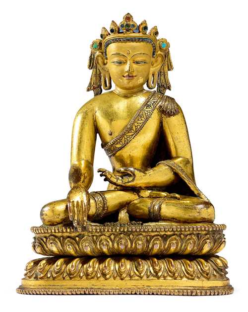 A POWERFUL GILT COPPER ALLOY FIGURE OF THE CROWNED BUDDHA.