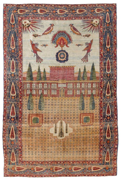 KIRMAN PICTORIAL CARPET, SILK antique.Attractive collector's item in good condition. Depiction of a garden landscape with a palace, the sky full of birds, blue edging patterned with cedars, 125x176 cm. Depicted in the catalogue of the Biennale 1992, page 413.