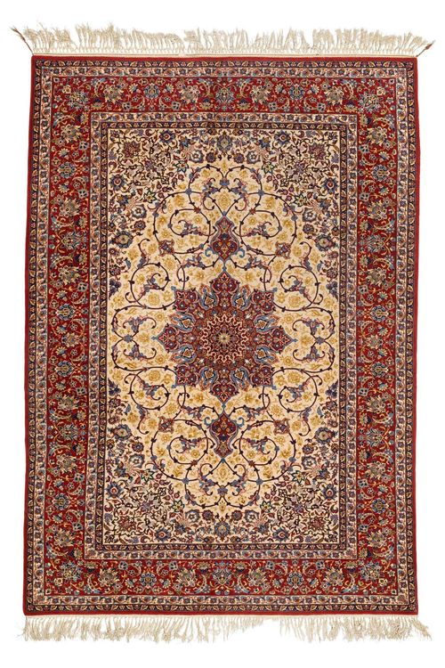 PAIR OF ISFAHAN old.White central field with a red central medallion, finely patterned with trailing flowers and palmettes, red edging, in good condition, 150x215 cm.