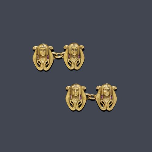 GOLD, RUBY AND DIAMOND CUFF LINKS, ca. 1920. Yellow gold 750. Decorative twin cuff links in the Egyptian Revival style, designed as a sculptured head of a Pharaoh flanked by 2 snakes, each cuff link additionally decorated with 4 small square-cut rubies and 2 rose-cut diamonds.