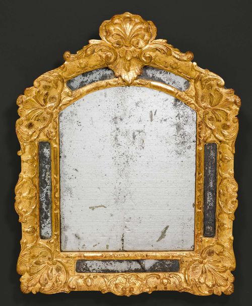 MIRROR,Regence, Paris circa 1740. Pierced and finely carved wood with leaves, cartouches and decorative frieze. Old mirror plate. H 68 cm. W 55 cm.