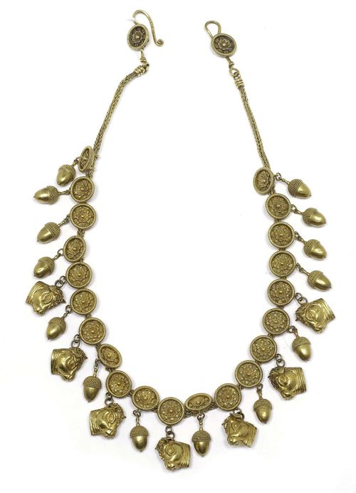 GOLD NECKLACE, LALAOUNIS. Yellow gold 750, 89g. Decorative necklace in the Hellenistic style, the front of numerous round ornaments with appliquéd flowers and ornaments of corded gold wire, the lower part with numerous alternately mounted pendants designed as bull heads and acorns. Signed. L ca. 39 cm.