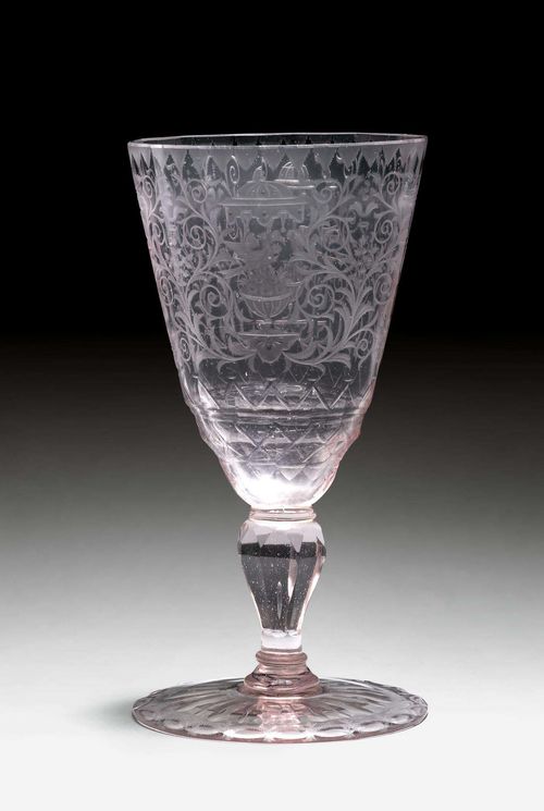 LOT OF 2 GLASS GOBLETS,Bohemia or Silesia, ca. 1770. Transparent glass. One cuppa facetted, with a conical form, the other oval-shaped. Both with a facetted baluster shaft. The smaller oval goblet carved with a figure of Saint Francis. H 16.7 cm, 10.2 cm. (2) Provenance: Gut Aabach, Risch am Zuger See.