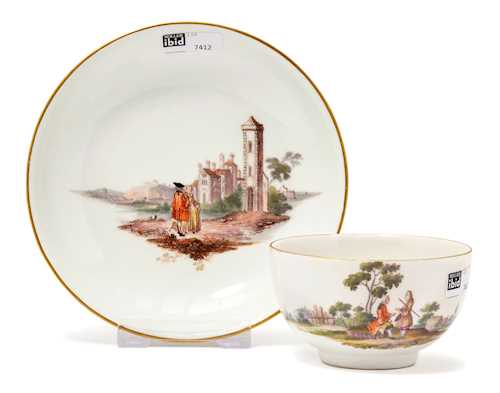 CUP AND SAUCER WITH A LANDSCAPE PAINTING