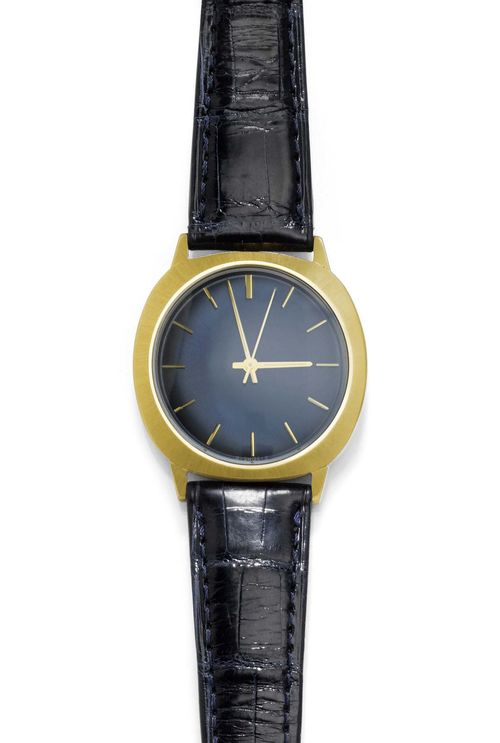 WRISTWATCH, AUTOMATIC, PATEK PHILIPPE, ca. 1970. Yellow gold 750. Ref. 3573, rare model with winding crown on the back, round case No. 2.693.798, with satin-finished lunette and attaches, screw-down back. Blue dial with appliqued luminous indices, Dauphine luminous hands, central second. Automatic, movement No. 1.491.600 with Gyromax balance. Black leather band with gold-coloured clasp, not original. D 36 x 34 mm. With case and copy of revision, January 2011.