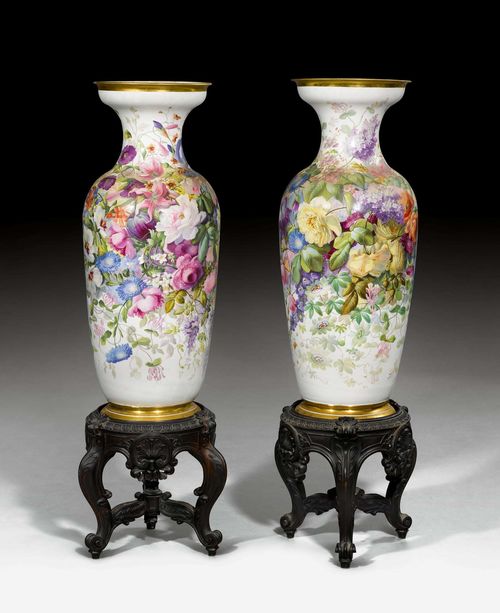PAIR OF LARGE LOUIS-PHILIPPE VASES,Paris, mid 19th century.R>Oval form with trumpet-shaped mouth, richly painted with colourful bouquets of flowers. Gilt rims. On two stands of carved wood. H 93 cm. (H including stand 143 cm) PLEASE NOTE: One Vase with a long hairline crack, estimate reads now: CHF 5000.-/8000.-