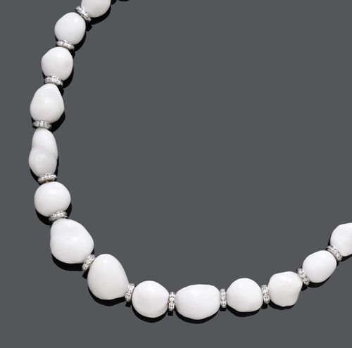 NATURAL PEARL AND DIAMOND NECKLACE. White gold 750. Rare, fancy necklace of 32 baroque, white, graduated natural pearls of ca. 10.9 x 8.2 to 20.2 x 14 mm, with 31 brilliant-set rondelles as intermediate pieces. Rondelles and clasp set with a total of 371 brilliant-cut diamonds weighing ca. 5.67 ct. L ca. 51 cm. With case and SSEF Report No. 52438, September 2008.