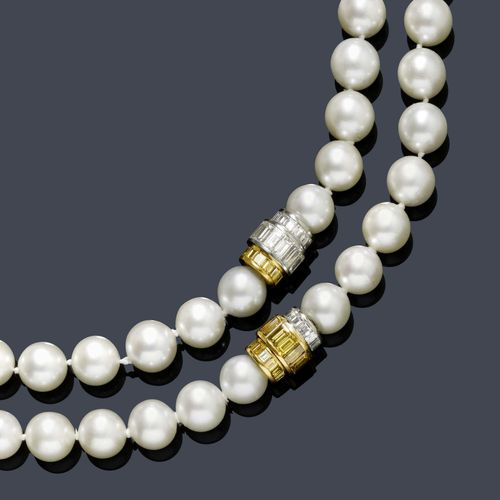 AKOYA PEARL AND DIAMOND SAUTOIR, HEMMERLE. White and yellow gold 750. Two classic-elegant necklaces of 38 and 42 very fine Akoya cultured pearls of ca. 10-10.5 mm Ø, the necklaces can be combined. Each with a cylindrical bicolour clasp of 3 rondelles of different sizes, alternately set throughout with numerous white and yellow baguette-cut diamonds. Total weight of the diamonds ca. 4.00 ct. L ca. 44 and 48 cm, respectively Akoya cultured pearls of this size are very rare.