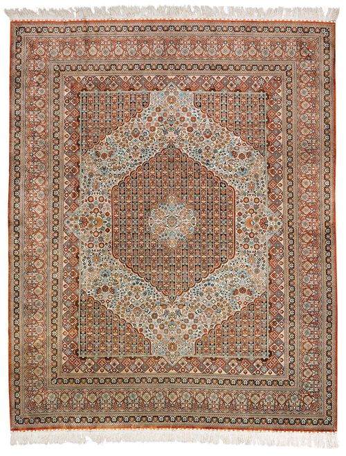 GHOM SILK.Red and blue central field with a central medallion, finely patterned with colourful floral motifs, red border, 250x305 cm.
