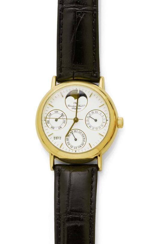 WRISTWATCH, AUTOMATIC, PERPETUAL CALENDER WITH MOON PHASE, IWC PORTOFINO, 1990s. Yellow gold 750. Gold case No. 2471406 with screw-down back. White dial with gold-coloured indices and hands, moon phase at 12h, data at 3h, month at 6h, and day of the week at 9h, central second, year window at 7.30h. Automatic movement No. 2440424, Cal. 37582, Gold rotor. Black leather band with IWC clasp. D 35 mm. With case.