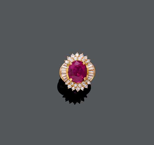 BURMA RUBY AND DIAMOND RING / PENDANT, ca. 1994. Yellow gold 750. Elegant ring, The top set with 1 very fine, oval Burma ruby weighing 8.72 ct, untreated, within a border of 14 trapeze-cut diamonds and 26 brilliant-cut diamonds. Total diamond weight ca. 1.50 ct. Size ca. 49. With G&#252;belin Report No. 9405016, May 1994.
