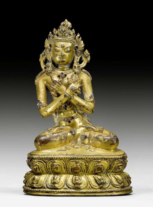 A GILT COPPER FIGURE OF VAJRADHARA WITH TURQUOISE AND CORAL INLAYS. Nepalese school in Tibet, 14th/15th c. Height 13 cm. Consecration plate lost.