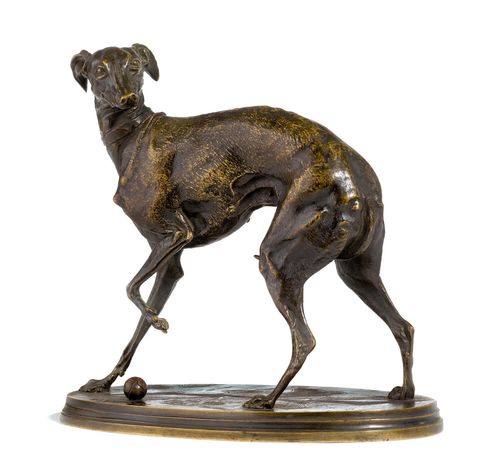 LEVRETTE JOUANT À LA BOULE (JIJI).Darkly patinated bronze, signed P.J. MÊNE. Workshop of P.J. Mêne (1838-1879). 16.5x9x15 cm.