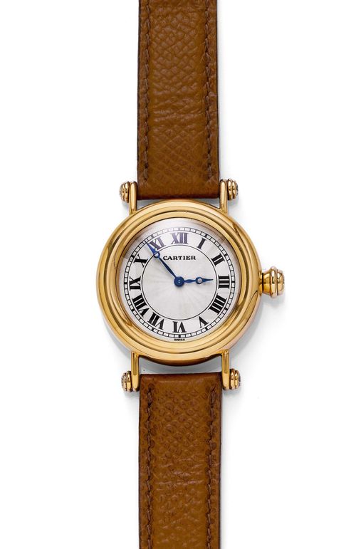 LADY'S WRISTWATCH, CARTIER DIABOLO, 1990s. Yellow gold 750. Ref. 1461-0. Polished case with a total of 5 diamonds at the crown and ends. Case No. R 3819. Silver-plated dial with black Roman numerals and blued Breguet hands. Hand winder No. 9202592, Cal. 9P2. Light brown leather band with gold Cartier fold-over clasp. D 32 mm.