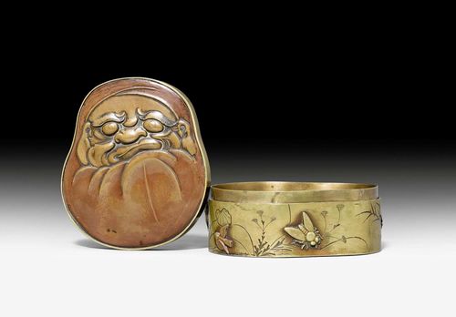 A FUNNY METAL BOX WITH DARUMA'S FACE ON THE COVER. Japan, Meiji period, length 10 cm.